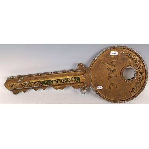 1154 - A large Yale metal advertising shop sign, in the form of a key, 77cm wide