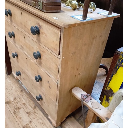 1343 - A stripped pine chest, having four long drawers, 97 cm wide