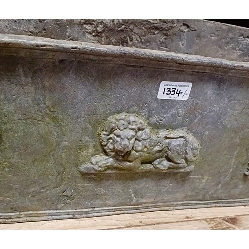 1334 - A pair of late 18th style lead garden planters, decorated lions and floral swags, by repute from the... 