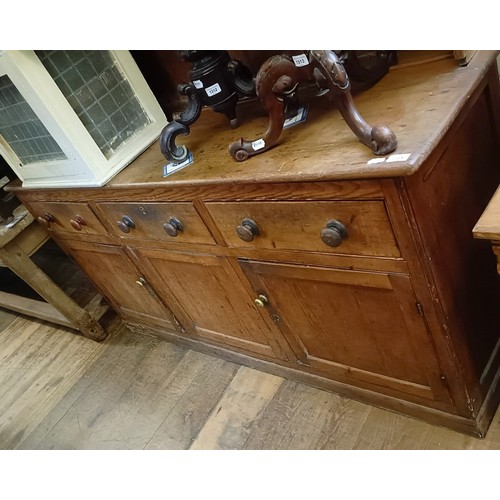 1314 - A late 19th century pine dresser, the three tier plate rack on a base with three drawers and three c... 