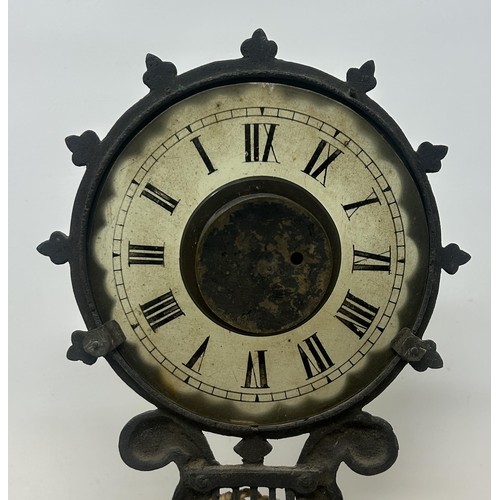 1228 - An unusual late 19th/early 20th century night clock, with a glass dial and a fixture on the back to ... 