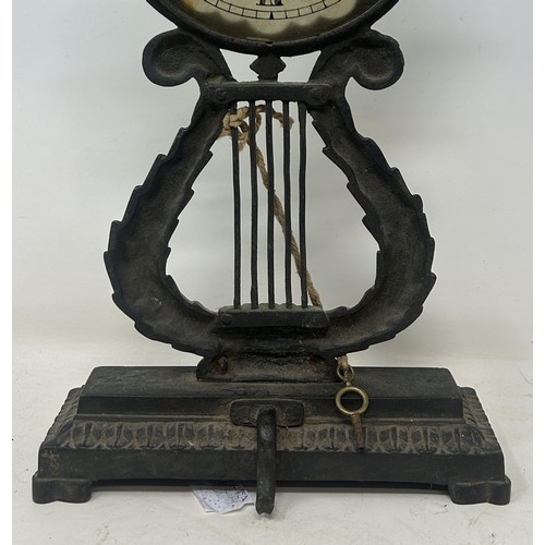 1228 - An unusual late 19th/early 20th century night clock, with a glass dial and a fixture on the back to ... 