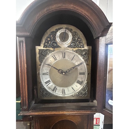 1245 - A longcase clock, the arched brass dial with a silvered chapter ring and St Michael, Whittington, an... 