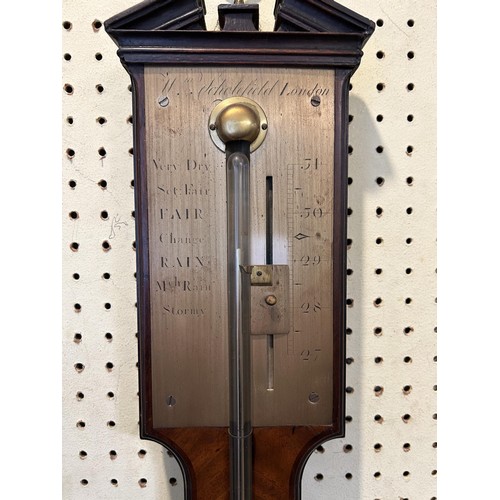 1243 - A George III style mahogany stick barometer, the silvered register signed Wm Scholefield, London, 95... 