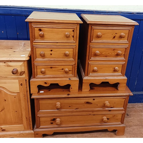 1373 - A pair of pine bedside chests, having three drawers, 40 wide, a set of six pine chairs, a pine cupbo... 