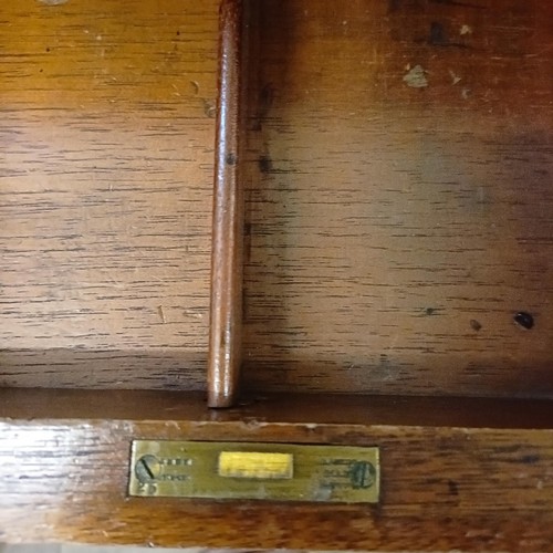 1251 - A Howard & Son mahogany pedestal desk, with nine drawers, 117 cm wide