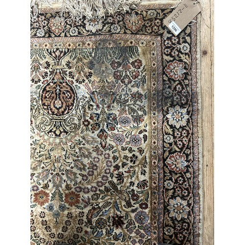 1296 - A Persian silk cream ground rug, with floral decoration, 157 x 92 cm