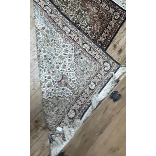 1297 - A Persian silk ground red ground rug, with floral decoration, 123 x 78 cm