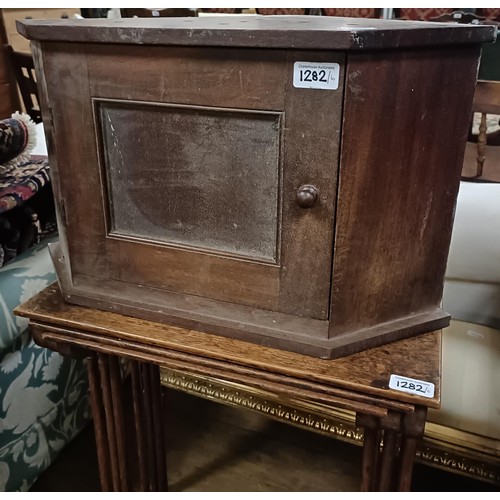 1282 - A nest of three oak tables, 46 cm wide, a piano stool, a gout stool, an oak low table, a pedest... 