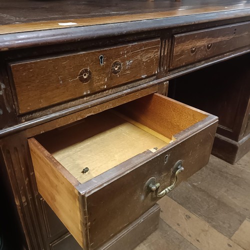 1277 - A George III style mahogany pedestal desk, with a leather inset top, 155 cm wide