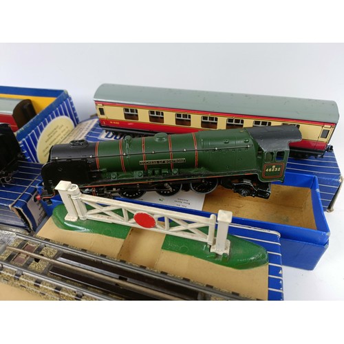 1021 - A collection of Hornby Dublo, including a Duchess of Atholl locomotive, a tender, TPO mail van set, ... 