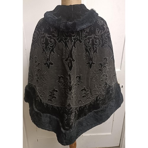 19 - A black velvet and beadwork shawl, with a fur lining Provenance:  A single owner collectio... 