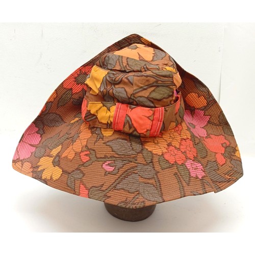 4 - A leather hatbox, an embroidered hat cover, decorated flowers, and assorted hats including a Jean-Ch... 