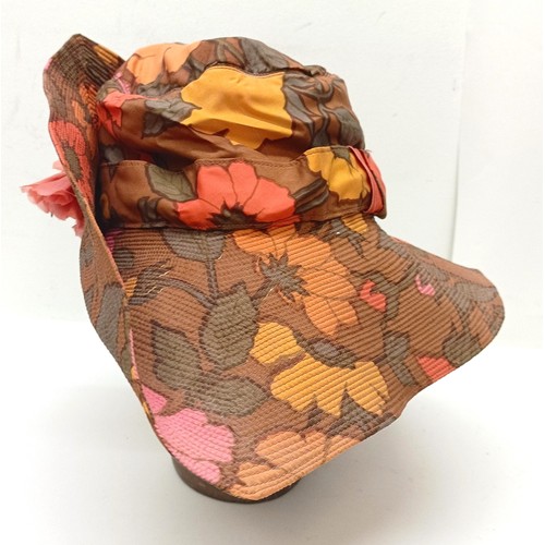 4 - A leather hatbox, an embroidered hat cover, decorated flowers, and assorted hats including a Jean-Ch... 