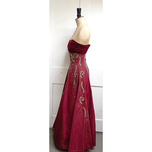 7 - A vintage female mannequin, on a metal tripod base, 170 cm high, and a red evening dressProvenance: ... 