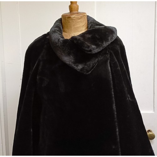 123 - A ladies faux fur full length coat by Wallis, size M/L