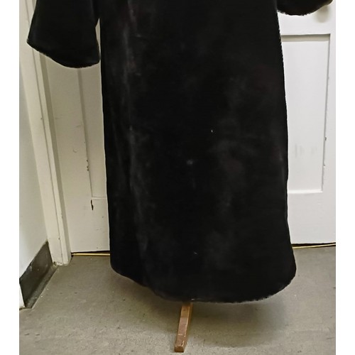 123 - A ladies faux fur full length coat by Wallis, size M/L