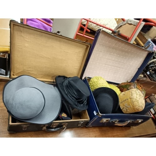 117 - Assorted hats, in two suitcases, three hat boxes and four bags (qty)