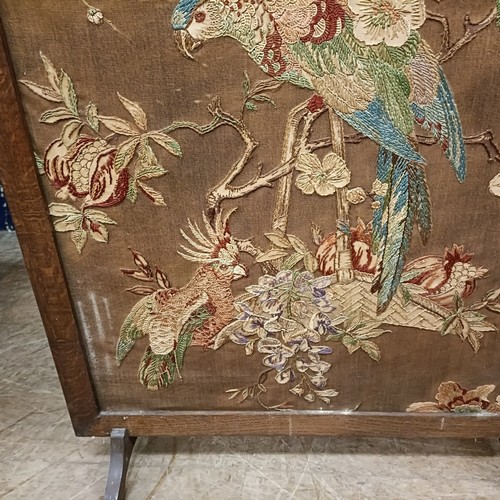 114 - An embroidered firescreen, decorted a parrot, 95 x 77, and another, 106 x 68 cm (2)