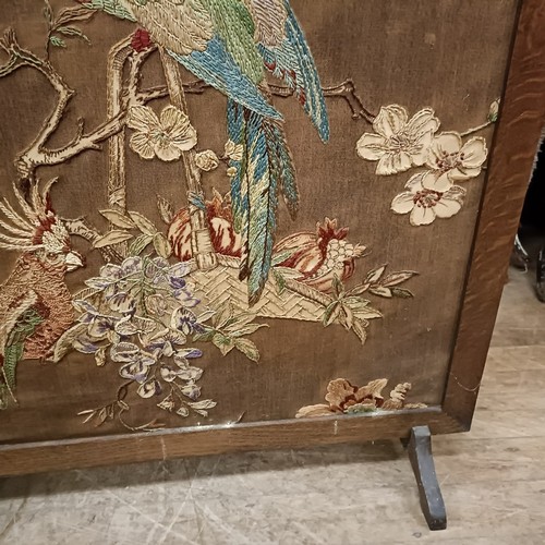 114 - An embroidered firescreen, decorted a parrot, 95 x 77, and another, 106 x 68 cm (2)