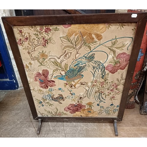 114 - An embroidered firescreen, decorted a parrot, 95 x 77, and another, 106 x 68 cm (2)