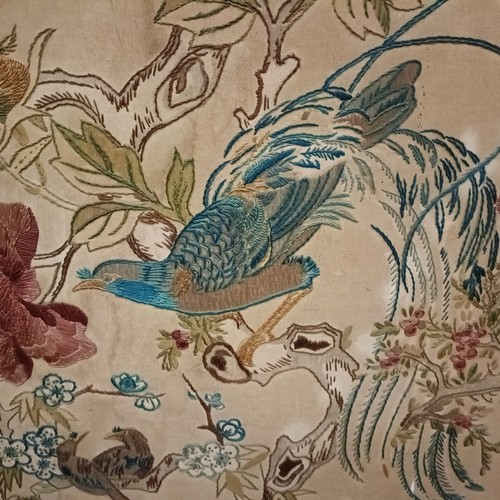 114 - An embroidered firescreen, decorted a parrot, 95 x 77, and another, 106 x 68 cm (2)