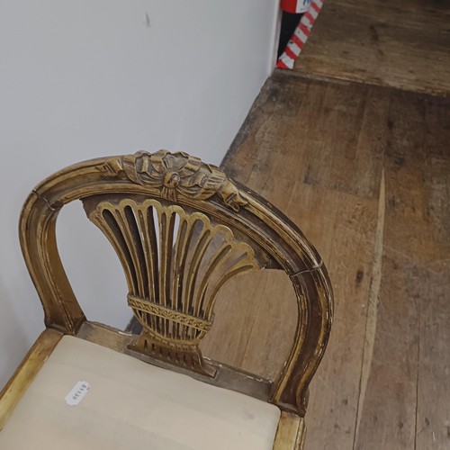 765 - An early 20th century gilt window seat, with pierced ends, on reeded tapering legs, 86 cm wide