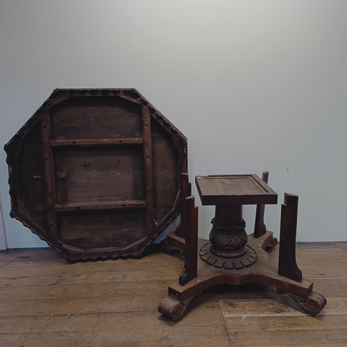 792 - A Victorian carved oak octagonal library table, on a carved column support to a shaped base, 140 cm ... 