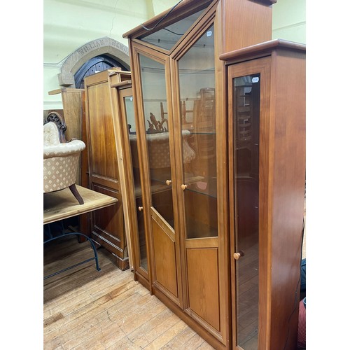 824 - A modern part glazed cupboard, 182 cm wide, a large glazed display unit, 140 cm wide, a G-Plan dinin... 