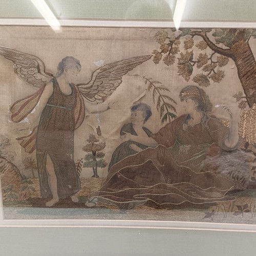 135 - A Regency silk embroidered panel, decorated figures and an angel, 28 x 40 cm