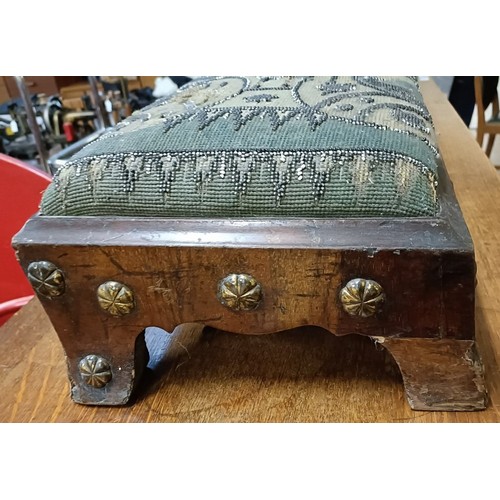 103 - A 19th century footstool, with a beadwork top, 124 cm wide