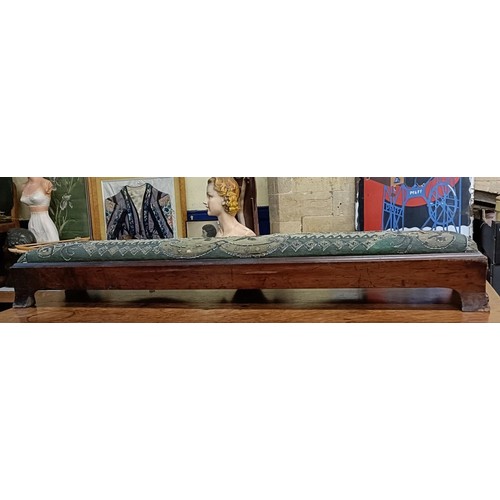 103 - A 19th century footstool, with a beadwork top, 124 cm wide