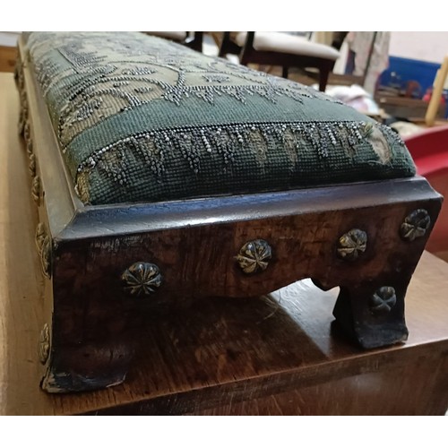 103 - A 19th century footstool, with a beadwork top, 124 cm wide