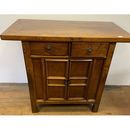 714 - A Chinese elm side cupboard, having two drawers and two cupboard doors, 112 cm wide