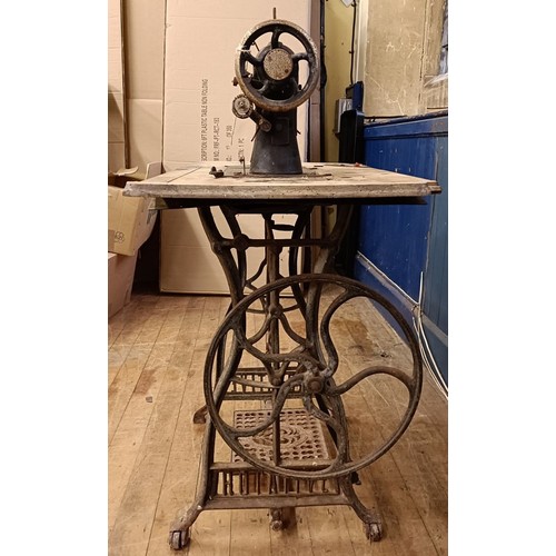 87 - A Liscot sewing machine, on an iron treadle base, barn stored , 90 cm wide Provenance:  A single own... 