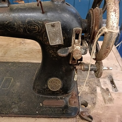 87 - A Liscot sewing machine, on an iron treadle base, barn stored , 90 cm wide Provenance:  A single own... 