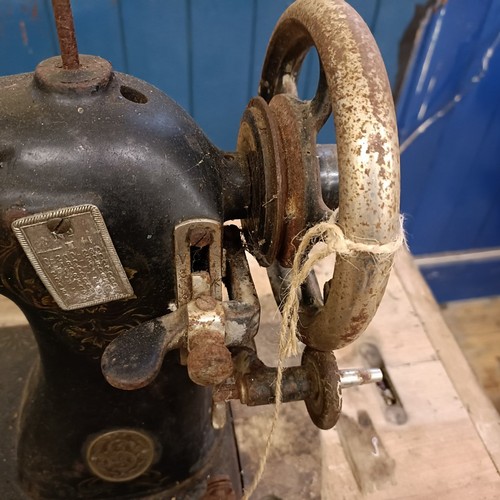 87 - A Liscot sewing machine, on an iron treadle base, barn stored , 90 cm wide Provenance:  A single own... 