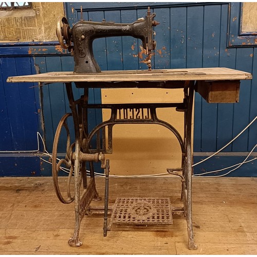 87 - A Liscot sewing machine, on an iron treadle base, barn stored , 90 cm wide Provenance:  A single own... 