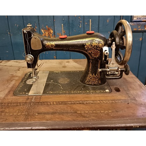 84 - An H Vigneron sewing machine, on an iron treadle base, 80 cm wide Provenance:  A single owner collec... 