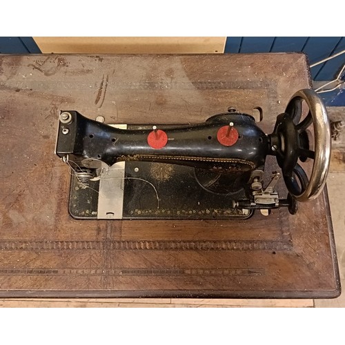 84 - An H Vigneron sewing machine, on an iron treadle base, 80 cm wide Provenance:  A single owner collec... 