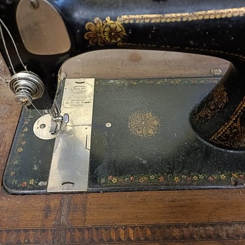 84 - An H Vigneron sewing machine, on an iron treadle base, 80 cm wide Provenance:  A single owner collec... 