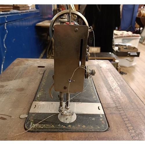 84 - An H Vigneron sewing machine, on an iron treadle base, 80 cm wide Provenance:  A single owner collec... 