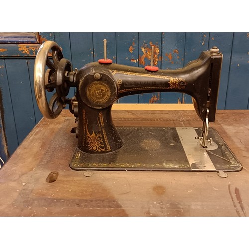 84 - An H Vigneron sewing machine, on an iron treadle base, 80 cm wide Provenance:  A single owner collec... 