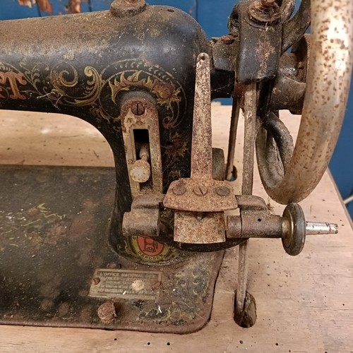 83 - A C Marque De Fabrique Rochet sewing machine, on an iron treadle base, barn stored, 74 cm wide Prove... 