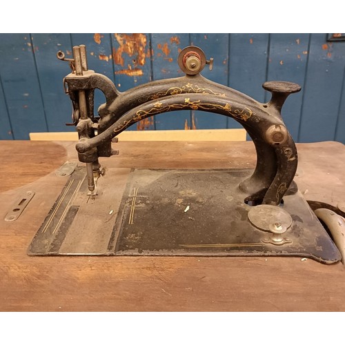 82 - A Peugeot Audincourt sewing machine, on an iron treadle base, 80 cm wide Provenance:  A single owner... 