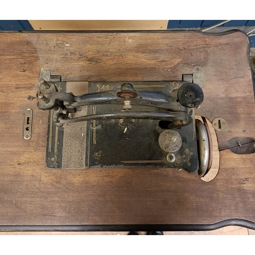 82 - A Peugeot Audincourt sewing machine, on an iron treadle base, 80 cm wide Provenance:  A single owner... 