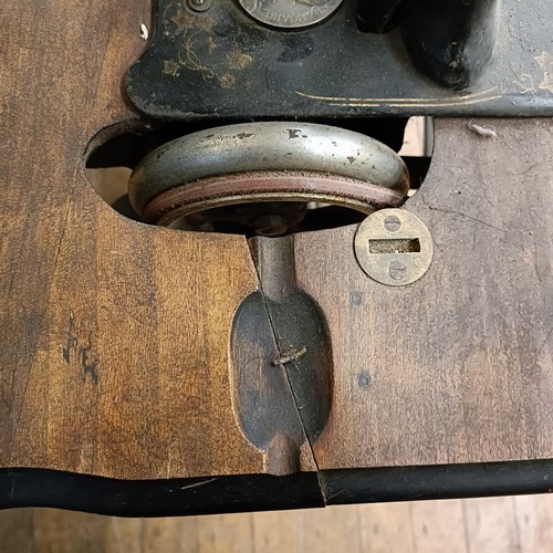 82 - A Peugeot Audincourt sewing machine, on an iron treadle base, 80 cm wide Provenance:  A single owner... 