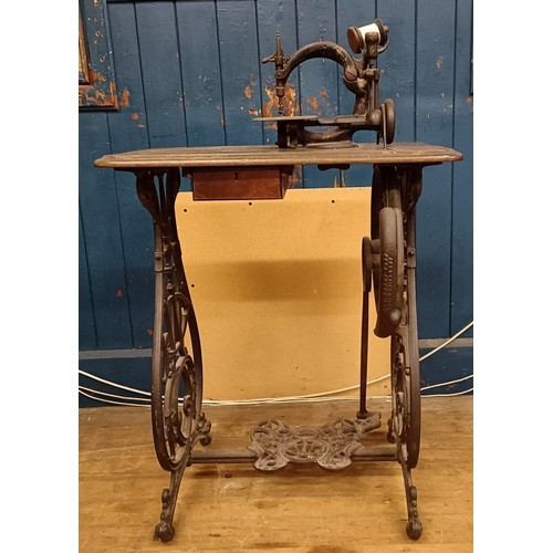 81 - A Willcox & Gibbs automatic silent sewing machine, on an iron treadle base, 50 cm wide Provenanc... 