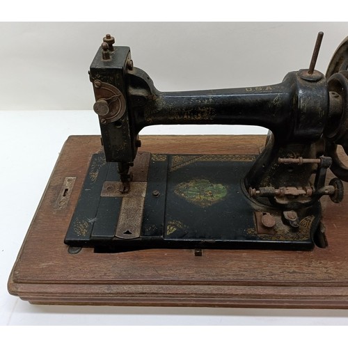 86 - An American White Sewing Machine Company sewing machine, lacking wooden case, 44 cm wide Provenance:... 