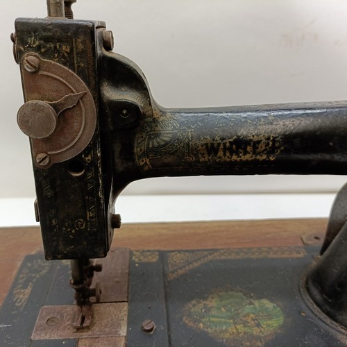 86 - An American White Sewing Machine Company sewing machine, lacking wooden case, 44 cm wide Provenance:... 